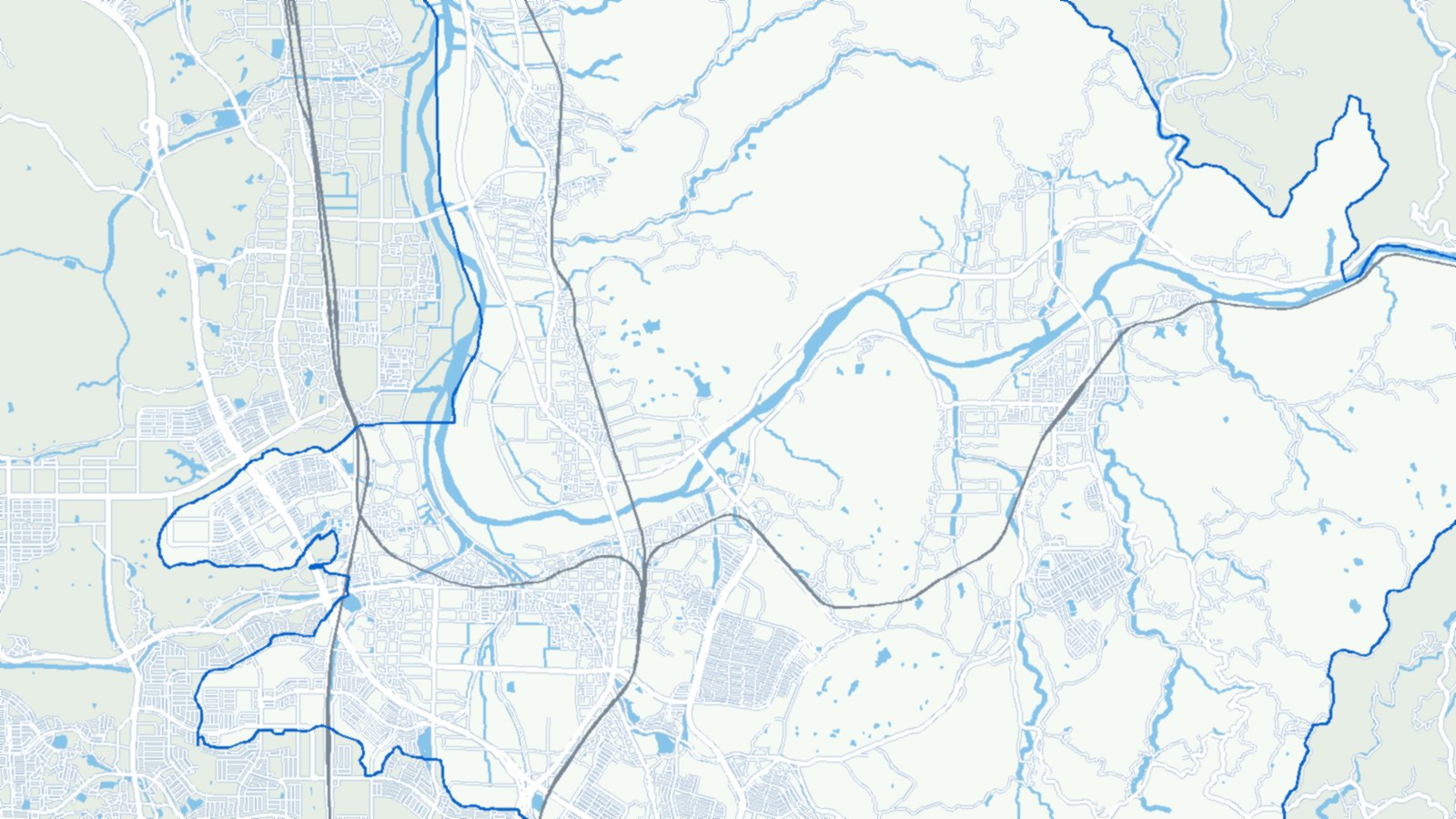 木津川市の地形図。木津川の流れと市街地、鉄道、市の境界を描いたもの