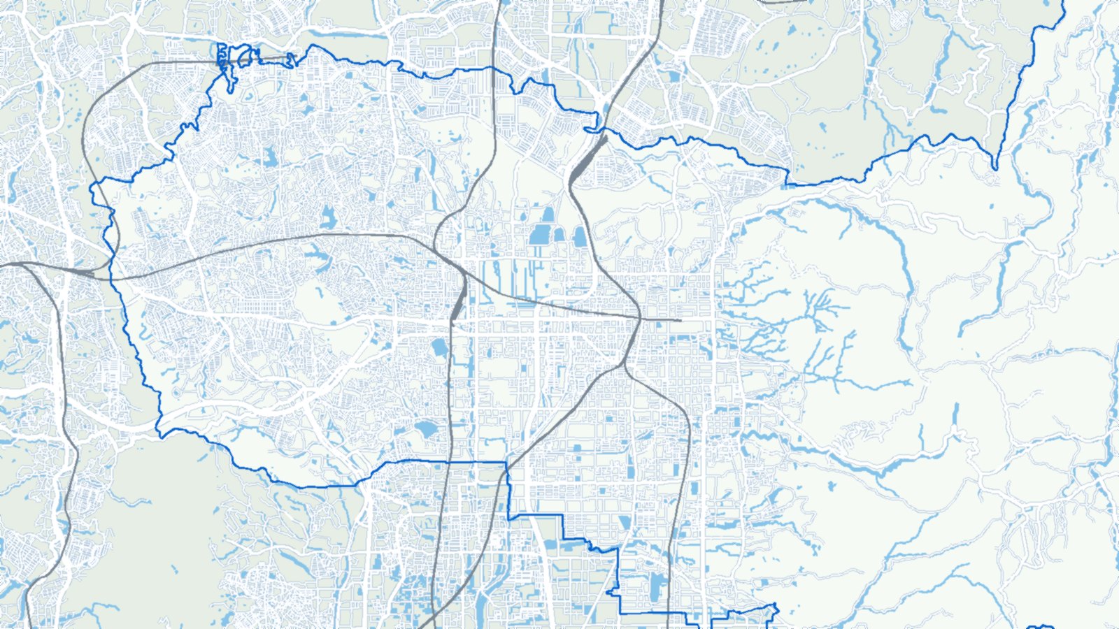 奈良市西部の地形図。市街地と、東にひろがる山地、鉄道と幹線道路を描いたもの